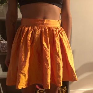 Super cute gathered orange shiny skirt